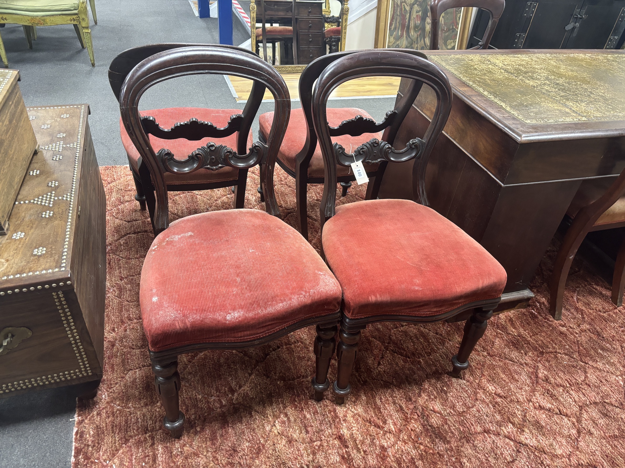 A set of six Victorian balloon back dining chairs